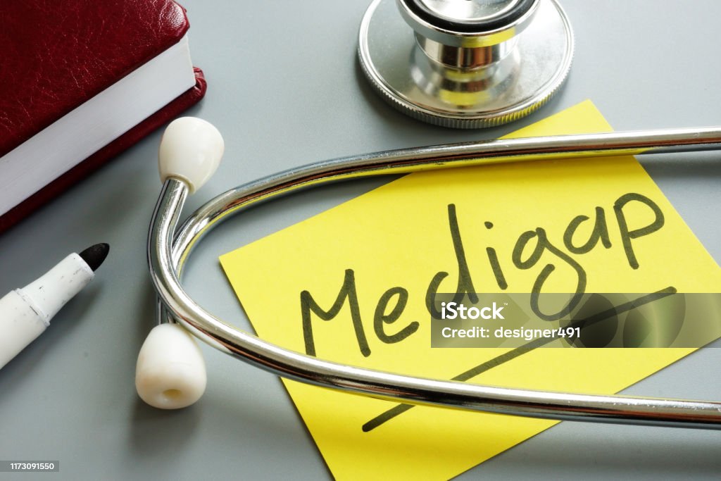 Medigap or medicare supplement insurance inscription and stethoscope. Medicare Stock Photo