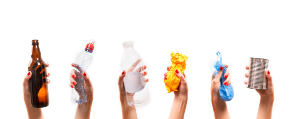 istock Different types of waste in the hands on a white background. Sort garbage and environment concept 1173091804