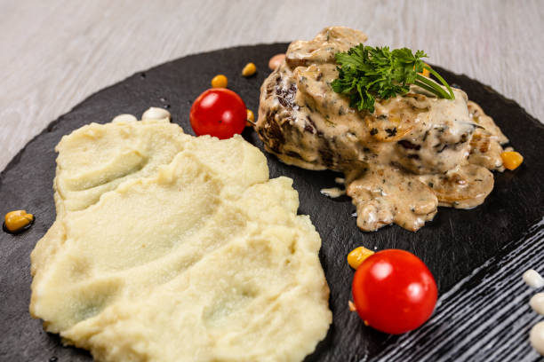 istock Delicious turkey breasts with roasted potato 1173094253