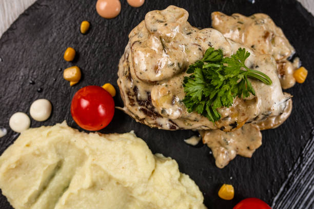 istock Delicious turkey breasts with roasted potato 1173094340