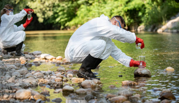 istock Biologist takes water from a forest river to study the composition in the laboratory 1173097188
