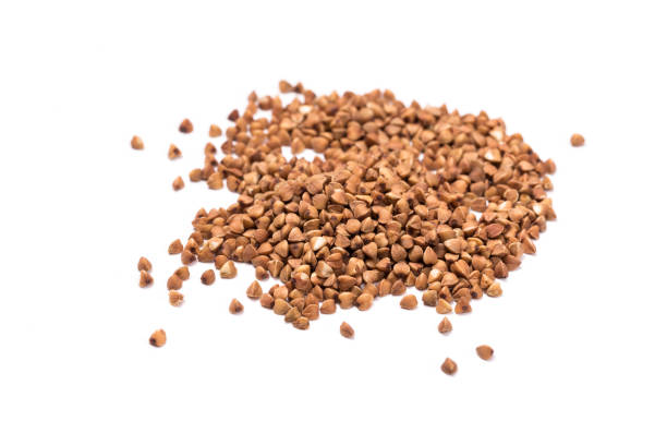istock raw buckwheat isolated on white background. 1173097431