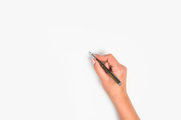 istock Female hands hold a pen. Isolated on white background. copy space, template. 1173098137