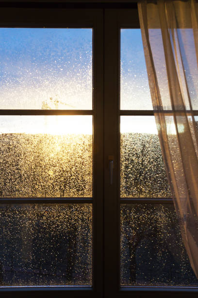 istock raindrops on a window pane at sunset