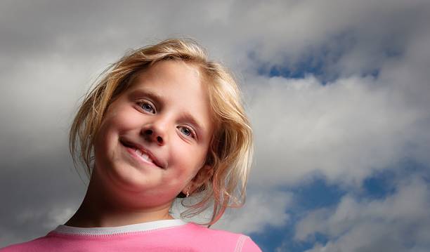 Happy child, clouds and blue sky