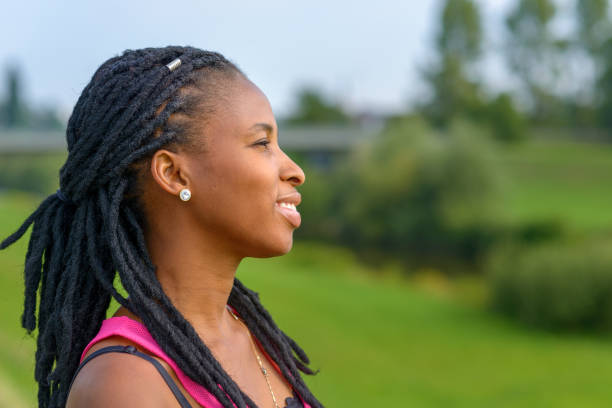 istock Attractive young African woman with braids 1173105218