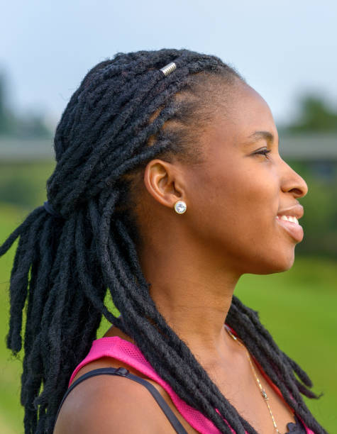 istock Attractive young African woman with braids 1173105232