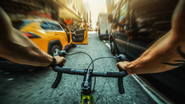 POV bicycle riding: road racing bike in New York POV bicycle riding: man with road racing bike in New York car door photos stock pictures, royalty-free photos & images