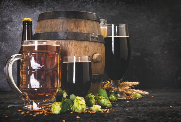 istock Beer Mug With Wheat And Hops With Barrel 1173106003