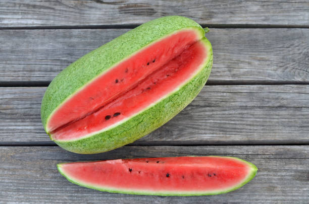 Ripe sweet slice of watermelon on a rustic background. Close up, top view