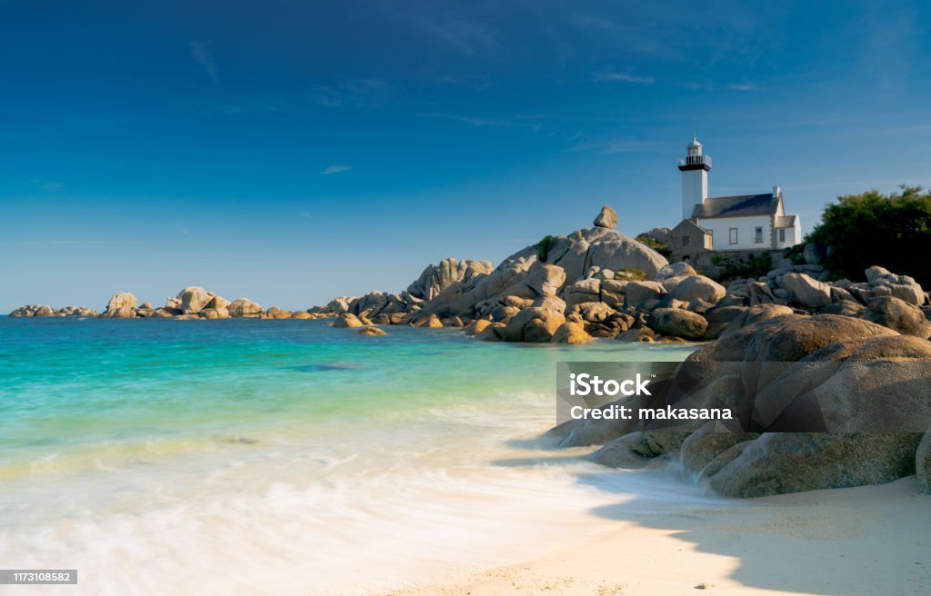 view of the Pontusval lighthouse and bay on the north coast of Brittany in France Horizontal view of the Pontusval lighthouse and bay on the north coast of Brittany in France Brittany - France Stock Photo