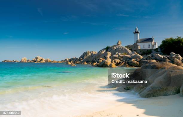 View Of The Pontusval Lighthouse And Bay On The North Coast Of Brittany In France Stock Photo - Download Image Now