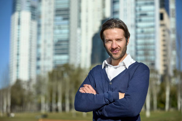 istock Confident handsome businessman with arms crossed 1173109681
