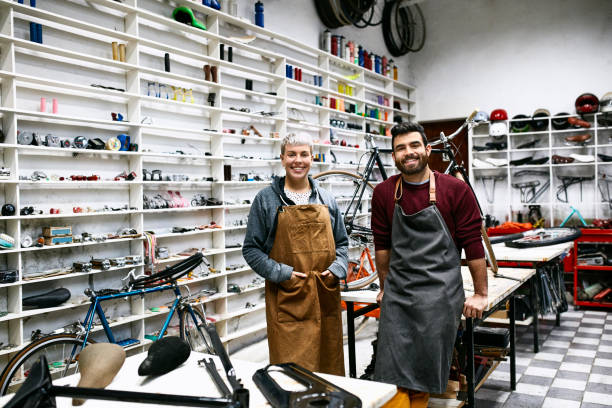 istock Portrait of smiling young mechanics at workshop 1173111843