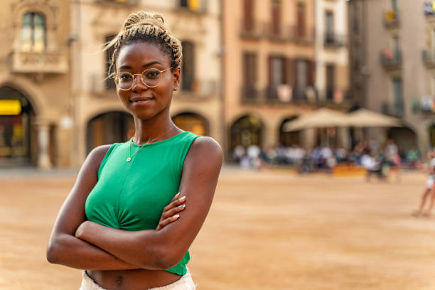Determined young woman in plaça Major in Vic stock photo