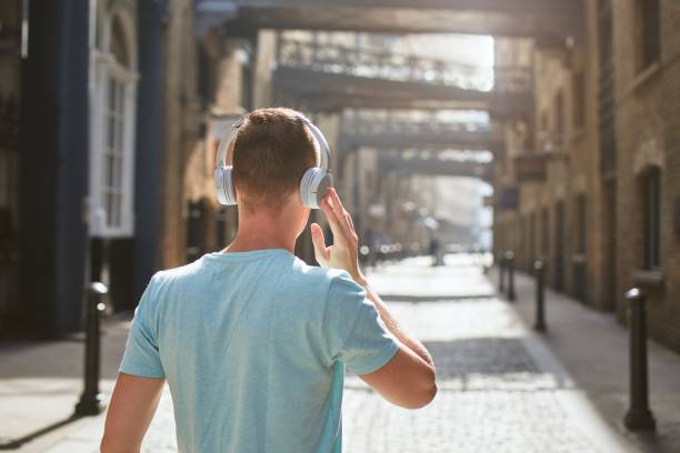 istock Man with headphones listening music 1173113677