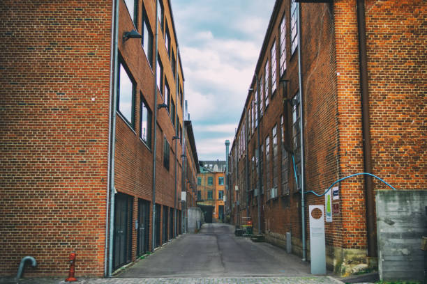 istock Old red brick industrial buildings. Toned photo. Architectural background. 1173115302