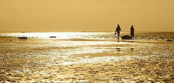 two men with the boat stock photo