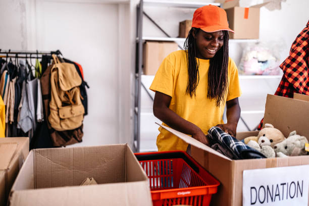istock African woman collecting donations 1173117717