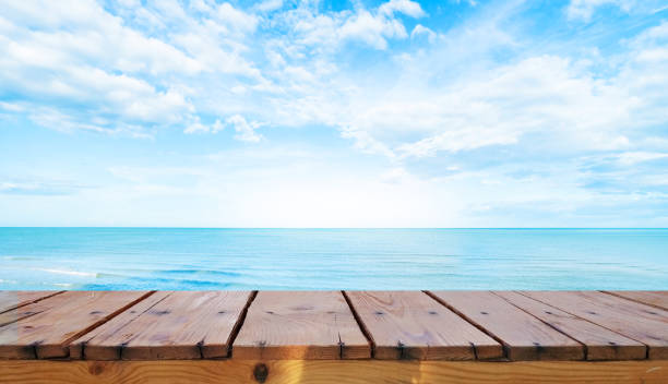 Wooden table top on blue sea