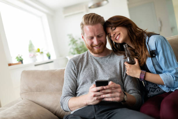 istock Young couple at home websurfing on internet 1173125324