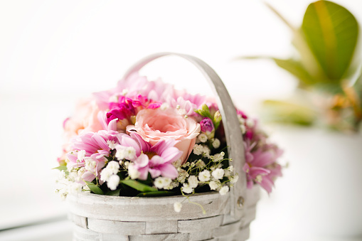 Beautiful flowers in a basket, vintage style.