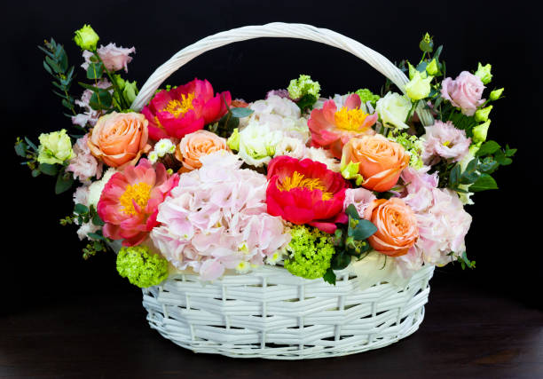 istock bright white flower arrangement in a basket on a dark background 1173126291
