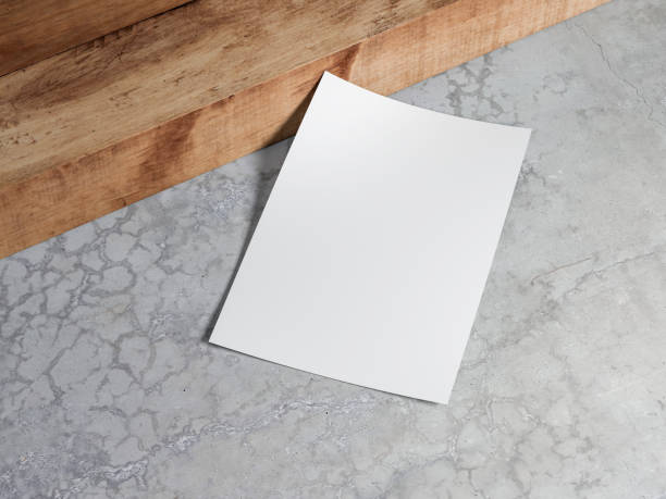 istock White vertical paper sheet Mockup lying on a concrete floor 1173126418