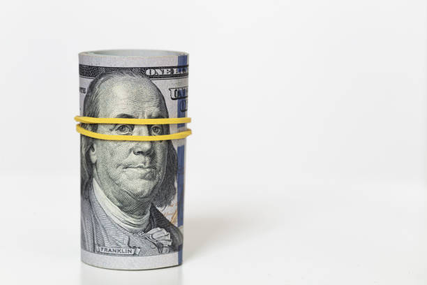istock roll of 100 dollar banknotes 1173127492