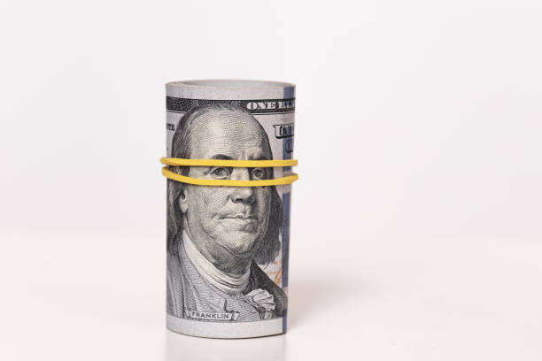 istock roll of 100 dollar banknotes 1173127591