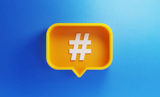 istock Speech Bubble Shaped Yellow Button with Hashtag Symbol on Blue Background 1173127912