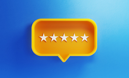 Speech bubble shaped yellow button with five stars on blue background. Horizontal composition with copy space. Feedback concept.