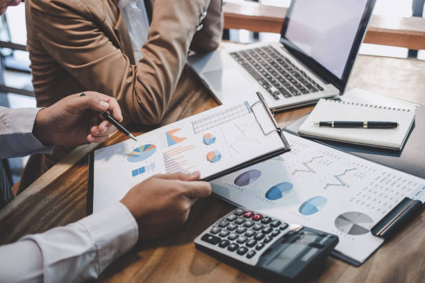 istock Business team working with new startup project plan and discussion information for financial strategy with laptop and digital tablet in a modern business lounge 1173129290