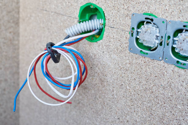 istock different wires in electrical outlet and switches on the wall 1173130254