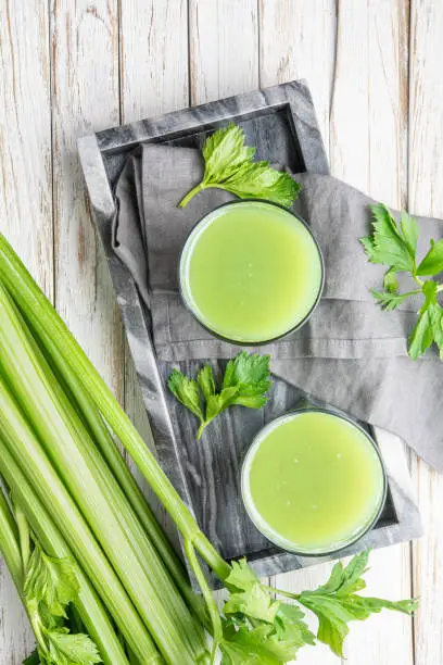 Photo of Freshly made pure celery juice in glass jars