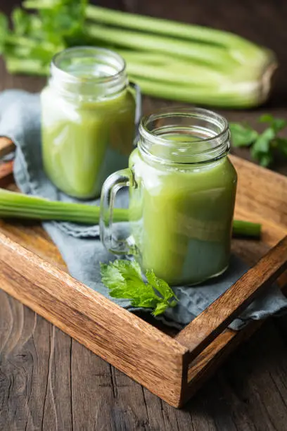 Photo of Freshly made pure celery juice in glass jars