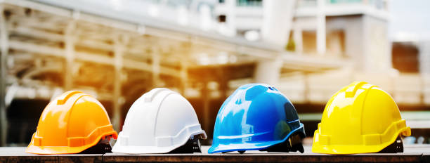 Quality contractor teamwork. Safety construction for engineer or building work site or plant. Wearing helmet and protective equipment can safe worker life in industrial work or plant. copy space stock photo