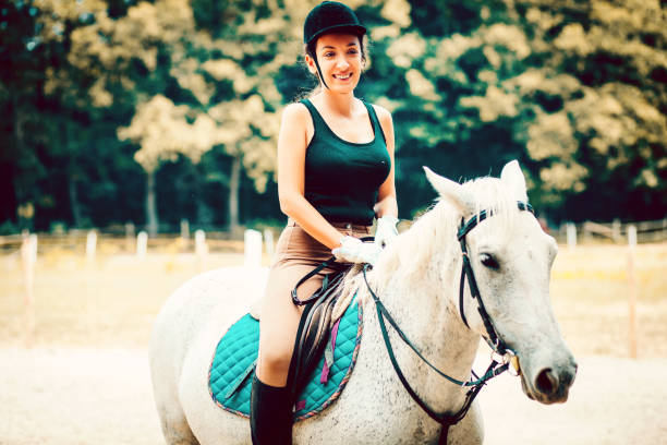 istock Horse and female rider on training 1173138940