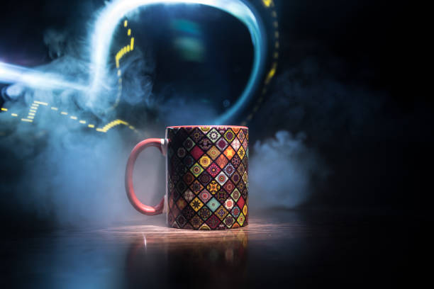 istock Beautiful eastern style textured ceramic cup of coffee (or tea) with smoke over dark toned background. 1173139971