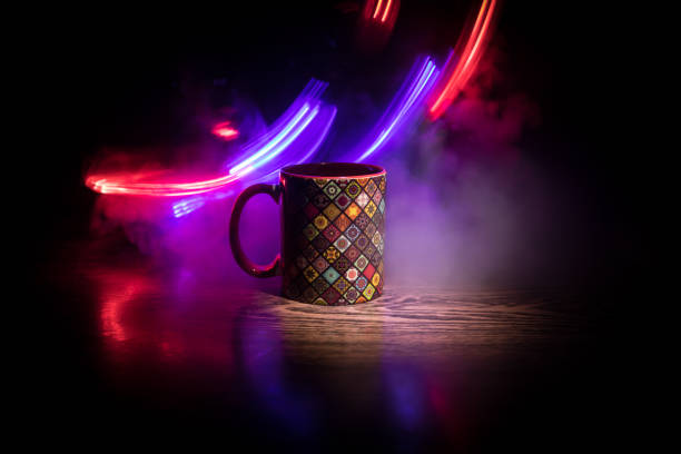 istock Beautiful eastern style textured ceramic cup of coffee (or tea) with smoke over dark toned background. 1173139977
