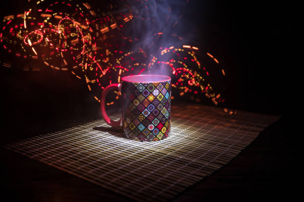 istock Beautiful eastern style textured ceramic cup of coffee (or tea) with smoke over dark toned background. 1173139985