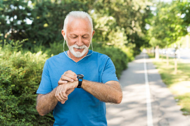 istock Sporty senior man using a smart watch. 1173140550