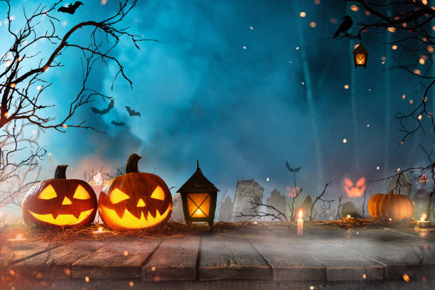 istock Halloween pumpkins on dark spooky forest. 1173140697