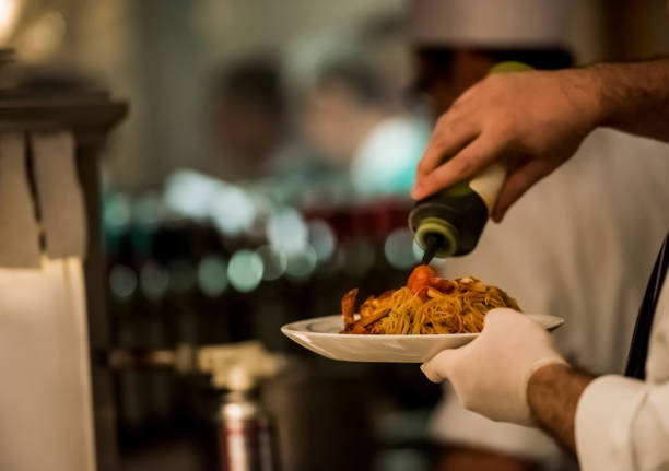 istock Chef preparing food at the kitchen 1173141629