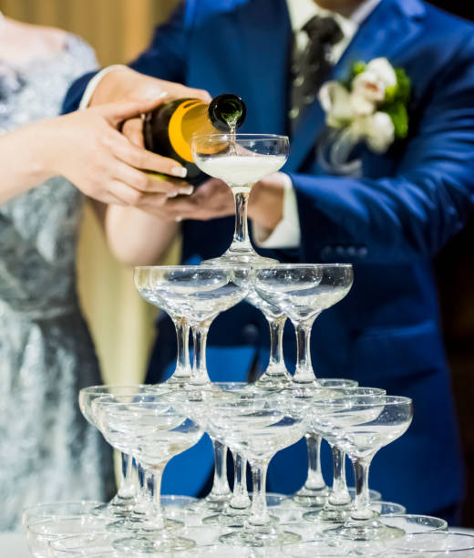 istock Couple holding champagne bottle 1173142356