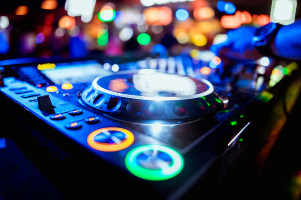 istock glowing lights from DJ mixer music remote buttons 1173145171