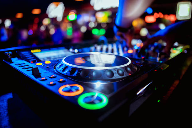 glowing lights from DJ mixer music remote buttons