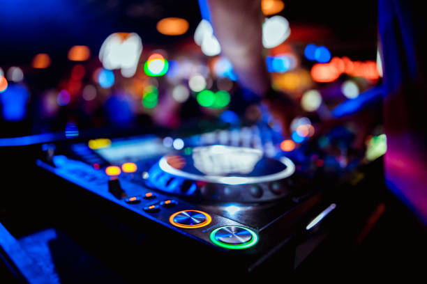 istock glowing lights from DJ mixer music remote buttons 1173145199
