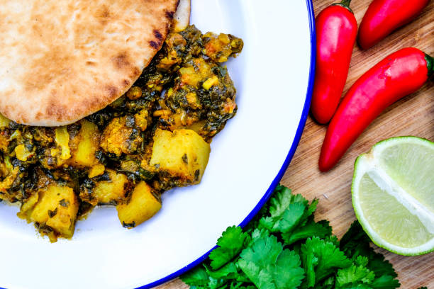 istock Indian Vegetarian Curry With Coriander and Flat Bread 1173147942