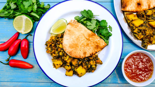 istock Indian Vegetarian Curry With Coriander and Flat Bread 1173147947